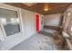 Spacious covered front porch with ample natural light streaming through the windows at 1421 Shepard St, Indianapolis, IN 46221