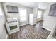 The Kitchen offers a gas range and grey cabinets with a view into another room at 1421 Shepard St, Indianapolis, IN 46221