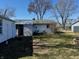 Backyard with shed, partial privacy fence, and view of house with newer central air conditioning unit at 143 Sawmill Rd, Whiteland, IN 46184
