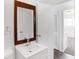Updated bathroom featuring a new vanity and framed mirror and laminate floors at 143 Sawmill Rd, Whiteland, IN 46184