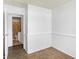 Bright bedroom features neutral carpet and a view into the bathroom at 143 Sawmill Rd, Whiteland, IN 46184