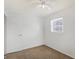 Bright bedroom features neutral carpet, a ceiling fan, and a window with blinds at 143 Sawmill Rd, Whiteland, IN 46184