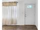 Bright entryway featuring wood floors and a front door with decorative window at 143 Sawmill Rd, Whiteland, IN 46184