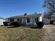 Quaint ranch-style home with tidy landscaping, featuring a detached garage and well-kept lawn at 143 Sawmill Rd, Whiteland, IN 46184