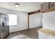 Stainless steel refrigerator, wood floors, and a bright open floorplan at 143 Sawmill Rd, Whiteland, IN 46184
