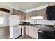 Cozy kitchen featuring ample cabinet space, laminate countertops, and modern appliances at 143 Sawmill Rd, Whiteland, IN 46184