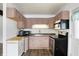 Cozy kitchen featuring ample cabinet space, laminate countertops, and modern appliances at 143 Sawmill Rd, Whiteland, IN 46184