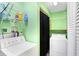 Utility Room with washer and dryer, storage shelving and updated fixtures at 143 Sawmill Rd, Whiteland, IN 46184