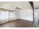 Open living space featuring modern wood floors, ceiling fan, and an open layout at 143 Sawmill Rd, Whiteland, IN 46184