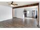 Bright living room area with wood floors leading to the kitchen at 143 Sawmill Rd, Whiteland, IN 46184