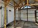 Partially enclosed patio with decorative lattice, brick pavers, and a covered roof at 143 Sawmill Rd, Whiteland, IN 46184