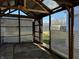 Enclosed patio with a metal roof, lattice walls, and concrete flooring at 143 Sawmill Rd, Whiteland, IN 46184