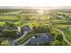 Desirable lot highlighted in yellow, backing onto a golf course with mature trees, providing privacy and scenic views at 16473 Valhalla Dr, Noblesville, IN 46060