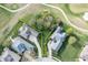 Bird's-eye view of a lot outlined in yellow, located amidst well-maintained lawns and mature trees, near a golf course at 16473 Valhalla Dr, Noblesville, IN 46060