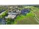 Aerial view of the golf course community with a pond and beautiful green fairways at 16473 Valhalla Dr, Noblesville, IN 46060