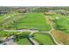 Scenic view of a meticulously groomed golf course, featuring expansive greens, a smooth cart path, and picturesque surroundings at 16473 Valhalla Dr, Noblesville, IN 46060