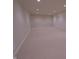 Large unfinished basement featuring neutral carpeting, recessed lighting, and potential for various uses at 1655 Rosebud Ln, Greenwood, IN 46143