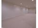 Unfinished basement with carpet and white paneled walls, offering ample space for storage or customization at 1655 Rosebud Ln, Greenwood, IN 46143