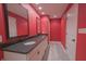 Well-lit bathroom features a double vanity with black countertop and large framed mirrors at 1655 Rosebud Ln, Greenwood, IN 46143