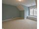 Spacious carpeted bedroom features a window seat beneath a large window with natural light at 1655 Rosebud Ln, Greenwood, IN 46143