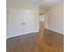 Bedroom with hardwood flooring, base trim, and closet at 1655 Rosebud Ln, Greenwood, IN 46143