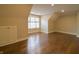 Bonus room with hardwood floors and a window bringing natural light for versatile usage at 1655 Rosebud Ln, Greenwood, IN 46143