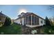 Elegant white brick home featuring a lovely screened porch, providing a relaxing outdoor space at 1655 Rosebud Ln, Greenwood, IN 46143