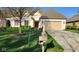 Lovely home with a well-kept lawn, mailbox, and a beige garage door under a bright blue sky at 1655 Rosebud Ln, Greenwood, IN 46143