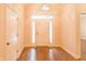 Welcoming home foyer with hardwood floors, chandelier, and view of the front door at 1655 Rosebud Ln, Greenwood, IN 46143