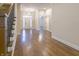 Inviting home foyer showcasing hardwood floors, chandelier, and a view of the front door at 1655 Rosebud Ln, Greenwood, IN 46143