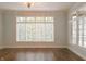 Living room with hardwood flooring and large windows at 1655 Rosebud Ln, Greenwood, IN 46143