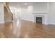 Inviting living area with hardwood floors, fireplace, staircase and view of the front foyer at 1655 Rosebud Ln, Greenwood, IN 46143