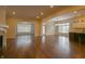 Open living space with hardwood floors and fireplace flowing into dining area and kitchen at 1655 Rosebud Ln, Greenwood, IN 46143