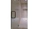Luxurious walk-in shower with sleek glass doors and beautiful tile work at 1655 Rosebud Ln, Greenwood, IN 46143