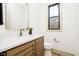Modern bathroom with vanity, white countertop, and neutral fixtures, offering a bright and sleek design at 1818 Central Ave, Indianapolis, IN 46202