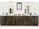 Bathroom features a double sink with white countertop, brown cabinets, and gold hardware at 1818 Central Ave, Indianapolis, IN 46202