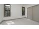 This is a bedroom with carpet, two windows, a closet, and white walls at 1818 Central Ave, Indianapolis, IN 46202