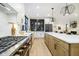 Spacious kitchen with a large island, modern appliances, and white cabinets at 1818 Central Ave, Indianapolis, IN 46202