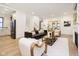 Open-concept living room with modern seating and seamless transitions to the kitchen at 1818 Central Ave, Indianapolis, IN 46202