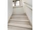 Carpeted staircase with neutral walls and base trim leading to the upper level, offering safe passage at 1818 Central Ave, Indianapolis, IN 46202