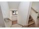 Stairwell showing wooden stairs with carpeted steps and railing leading to the upper or lower levels at 1818 Central Ave, Indianapolis, IN 46202