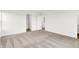 Bright bedroom with neutral carpet, white trim, and a doorway leading to a closet at 2004 Foothill Dr, Greenfield, IN 46140