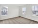 Bright bedroom with neutral carpet and windows overlooking the neighborhood at 2004 Foothill Dr, Greenfield, IN 46140