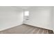 Bright, carpeted bedroom with white walls and a single window for natural light at 2004 Foothill Dr, Greenfield, IN 46140