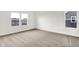 Bright bedroom featuring plush carpeting and two large windows offering natural light at 2004 Foothill Dr, Greenfield, IN 46140