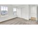 Bright bedroom with two windows, neutral carpet, and closet with sliding doors at 2004 Foothill Dr, Greenfield, IN 46140