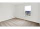 Bright bedroom with neutral carpet and a window with neighborhood views at 2004 Foothill Dr, Greenfield, IN 46140