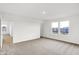 Bright bedroom with large windows, neutral carpet, and doorway to other rooms at 2004 Foothill Dr, Greenfield, IN 46140