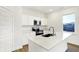 Stylish kitchen featuring stainless steel appliances, white cabinets, and a quartz countertop island at 2004 Foothill Dr, Greenfield, IN 46140