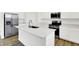 The kitchen features a big island, stainless steel appliances, and white cabinetry at 2004 Foothill Dr, Greenfield, IN 46140